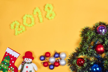 Flat lay of Christmas decoration on yeallow background