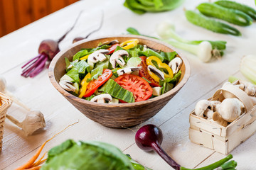 vegetable salad bowl on kitchen table, balanced diet