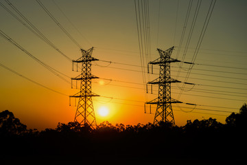 Fototapeta premium High voltage power tower at sunset in Brisbane, Queensland.