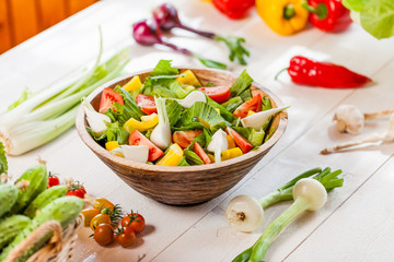vegetable salad bowl on kitchen table, balanced diet
