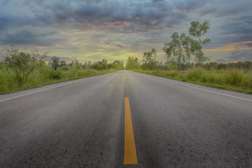 Naklejka premium Thailand country road and storm sky in background.