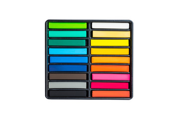 Set of colorful chalk stick on black tray