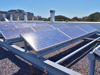 Solar panels or Solar cells on rooftop or terrace of building in Cape Town, South Africa. Can saving energy. Green or Sun or renewable or Clean energy.