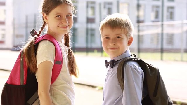  Smiling children showing thumbs up sign. 