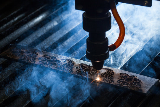 Laser makes engraving on leather belt