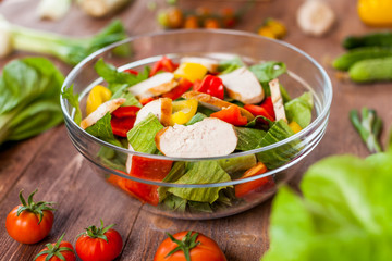 chicken salad bowl on kitchen table, balanced diet