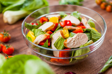 chicken salad bowl on kitchen table, balanced diet