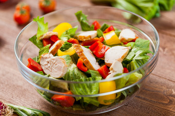 chicken salad bowl on kitchen table, balanced diet