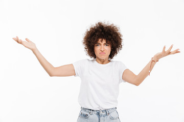 Frustrated young woman standing in confusion