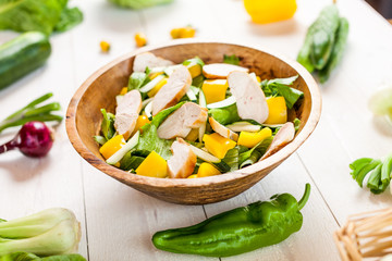 chicken salad bowl on kitchen table, balanced diet