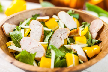 chicken salad bowl on kitchen table, balanced diet