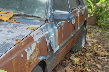 Background old car corroded rusty metal wall painted white background with metal rust stains, rust car, rust stains .