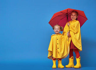 children with red umbrella