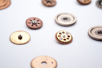 Detail of watch machinery on the table. 