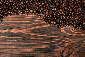 Coffee beans on wooden background