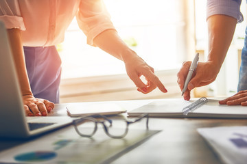 man and woman working in the office