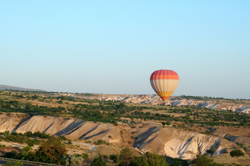 ballooning. Bright multicolored balloon against the blue sky