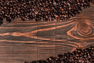Coffee beans on wooden background