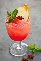 Beautiful Fruit cocktail on black background with berries