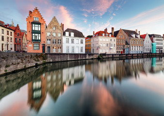 Fototapeta na wymiar Bruges canals, Spiegelrei with reflection old houses at sunset. Belgium