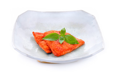 Dolly baked fish sauce on white background.