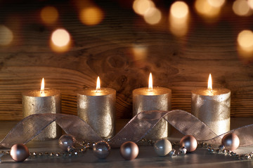 Obraz na płótnie Canvas Christmas still life with candles and bokeh