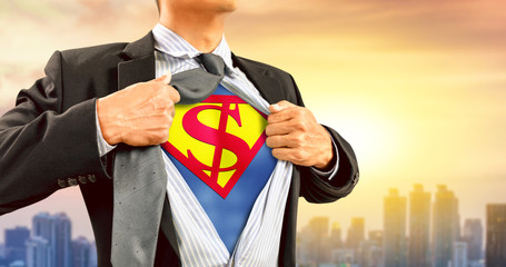 businessman in superhero costume with dollar sign © Warakorn