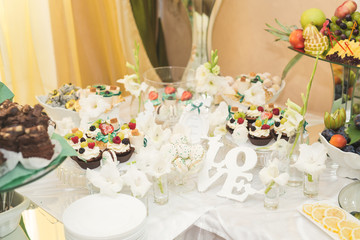 Different kinds of baked sweets on a buffet