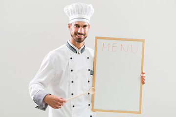 Chef  is showing whiteboard on gray background.