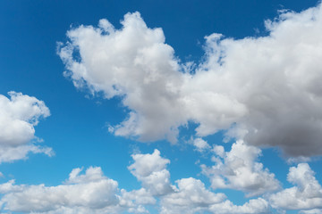 Naklejka na ściany i meble Clouds in the blue sky, background