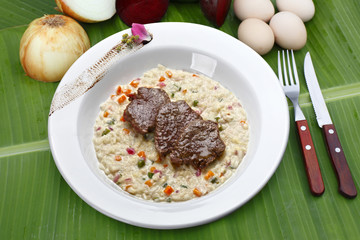 Risotto with vegetables and grilled steak