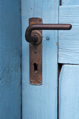 closeup of blue door with old doorhandle