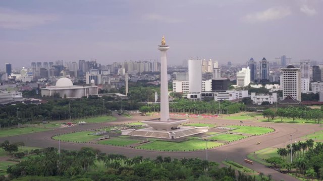 National Monument in the centre of Merdeka Square, Central Jakarta, symbolizing the fight for Indonesia. Filmed from above, fast motion. Shot with Sony a7s and Atomos Ninja Flame.
