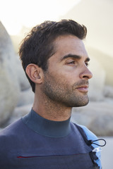 Fototapeta premium Handsome wetsuit guy in profile, looking away