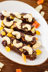 Chocolate bars with cashew and candied fruits