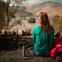 Woman Rests By a Loch