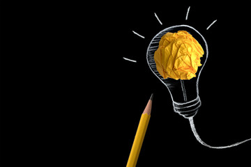 the yellow pencil with yellow crumpled paper ball and hand drawn a light bulb , creative innovation idea symbol concept