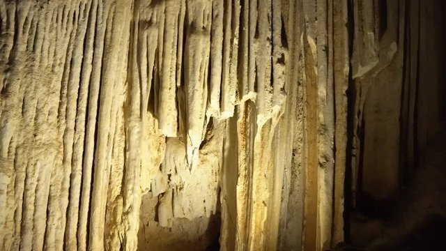 The stalactites and white rock formations inside the cave in Nerja Spain the cave is found inside the mountain