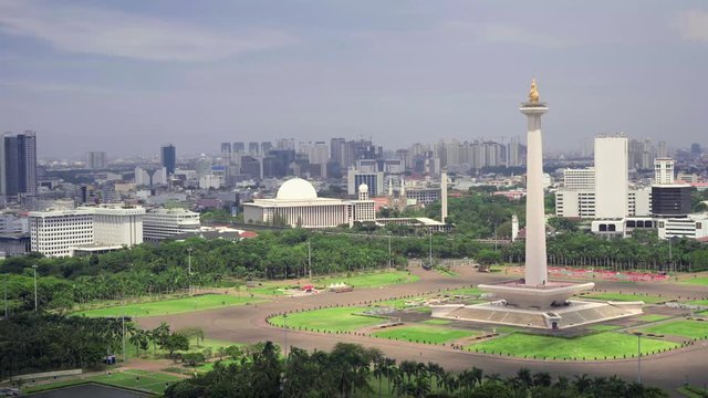 National Monument in the centre of Merdeka Square, Central Jakarta, symbolizing the fight for Indonesia. Filmed from above, fast motion. Shot with Sony a7s and Atomos Ninja Flame.