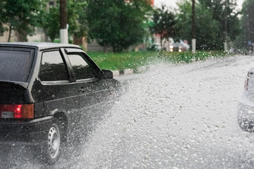 car rain puddle splashing water