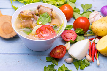 Oxtail soup in white dish on blue  table, Delicious halal food