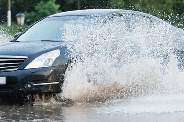 car rain puddle splashing water