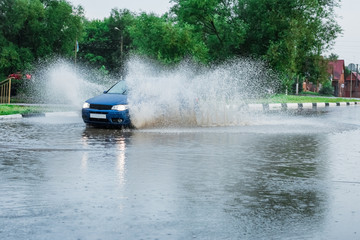 Fototapeta premium car rain puddle splashing water