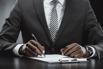 african american businessman doing paperwork