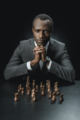 african american businessman and chess figures