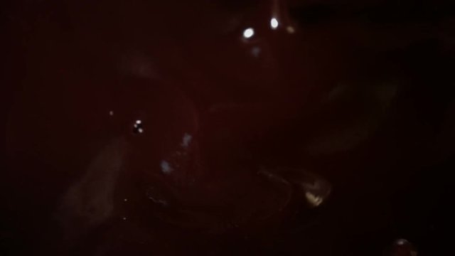 High quality video of raspberries falling into chocolate in real 1080p slow motion 250fps