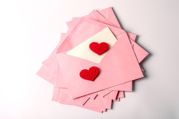 close up Stacking of pink envelopes and mail letter paper and the red herat , romance  love letter concept for holiday valentines day greeting card concept