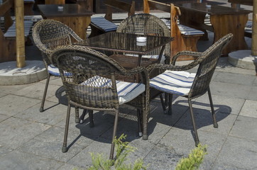 View of cosy nook for summer relaxation with table, chair and wooden bench, park  Borisova gradina, Sofia, Bulgaria  