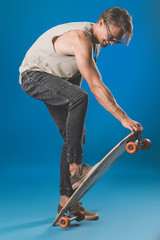 Fototapeta na wymiar young man with skateboard