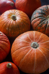 Organic ogange pumpkins on wooden table, thanksgiving pumpkin background, autumn harvest